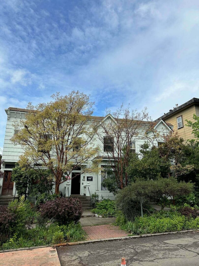 Pale blue Victorian facade with garden