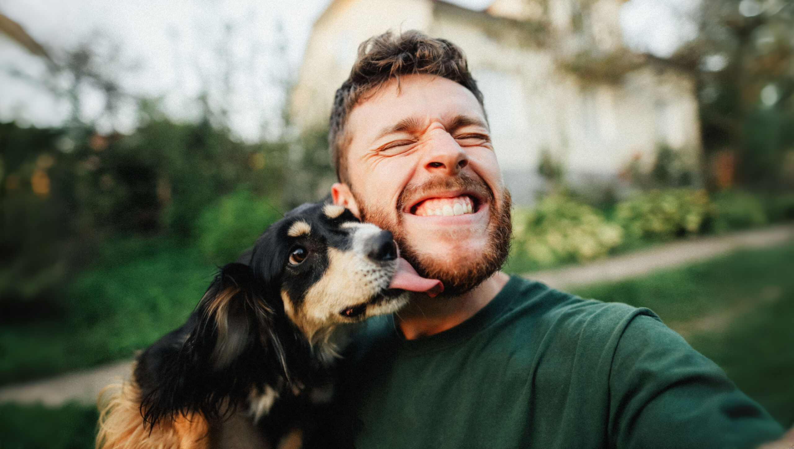 Man taking selfie with dog